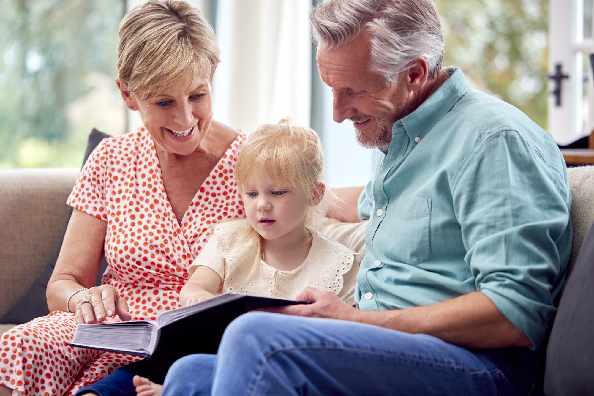 Family looking through old records while researching Irish ancestry