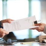 Close-up of an official certificate application form being reviewed