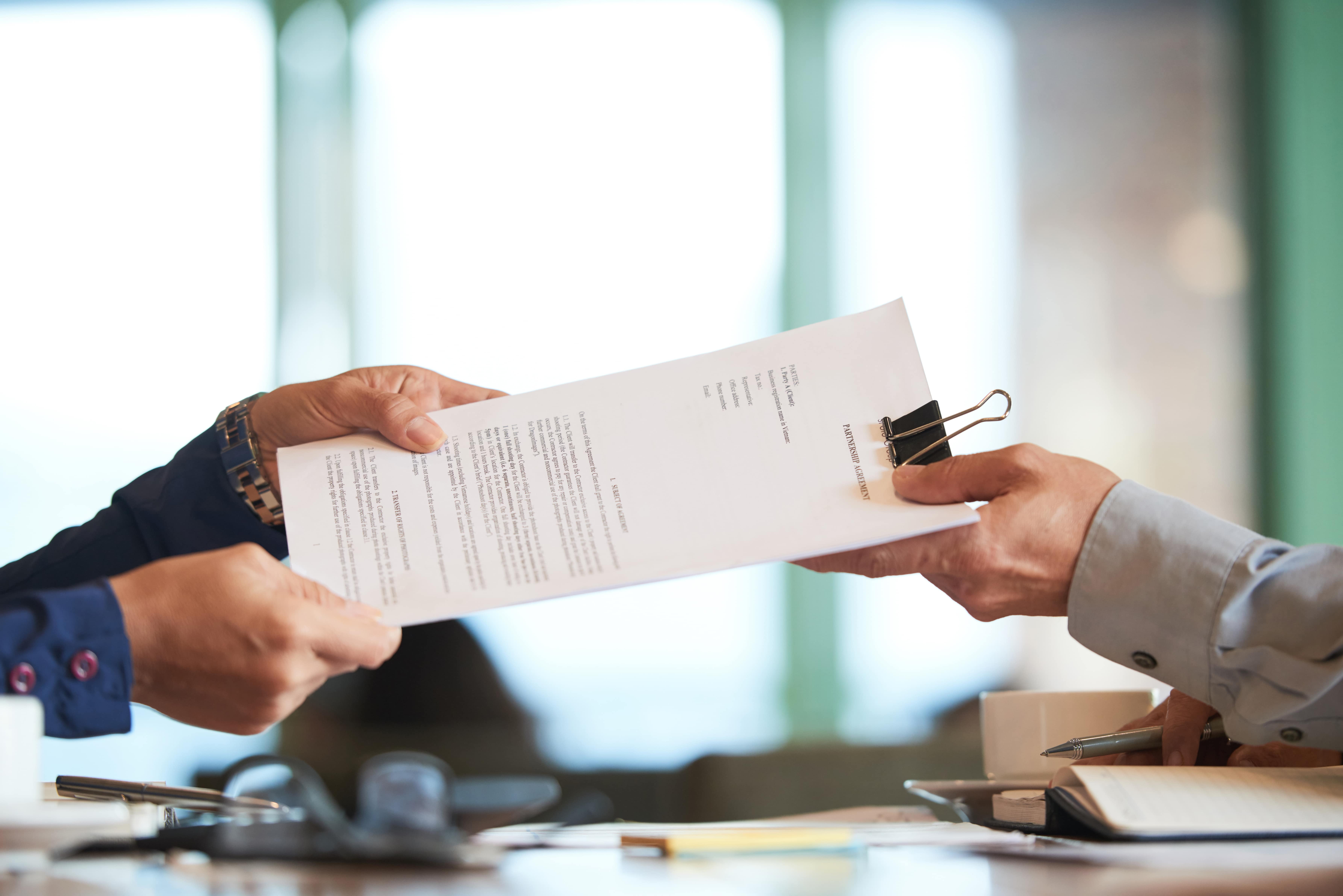 Person reviewing certificate documents for an Irish citizenship application